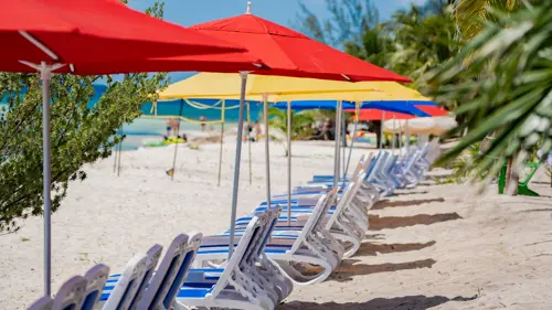 Relaxing at KUZÁ deluxe beach access with lounge chairs
